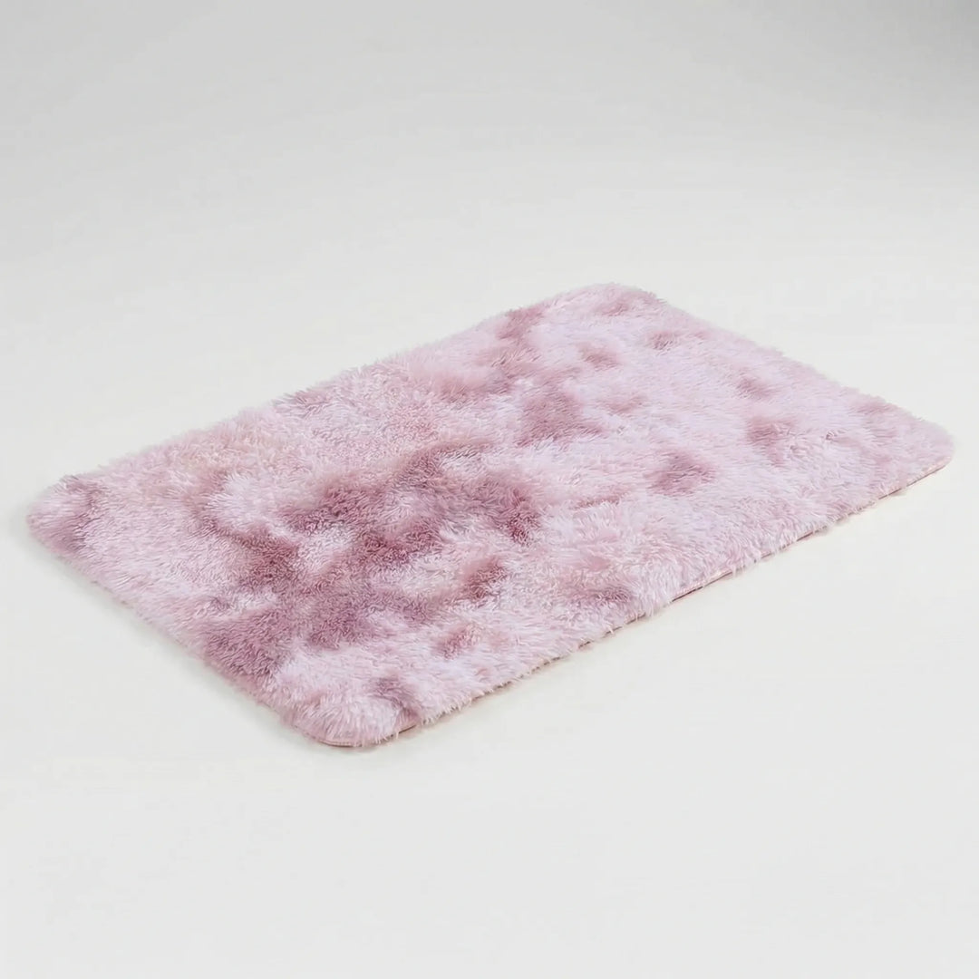 Soft, low pile plush floor mat with a modern wave design. This non-slip washable rug enhances any room's decor.