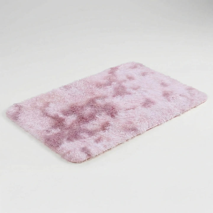 Soft, low pile plush floor mat with a modern wave design. This non-slip washable rug enhances any room's decor.
