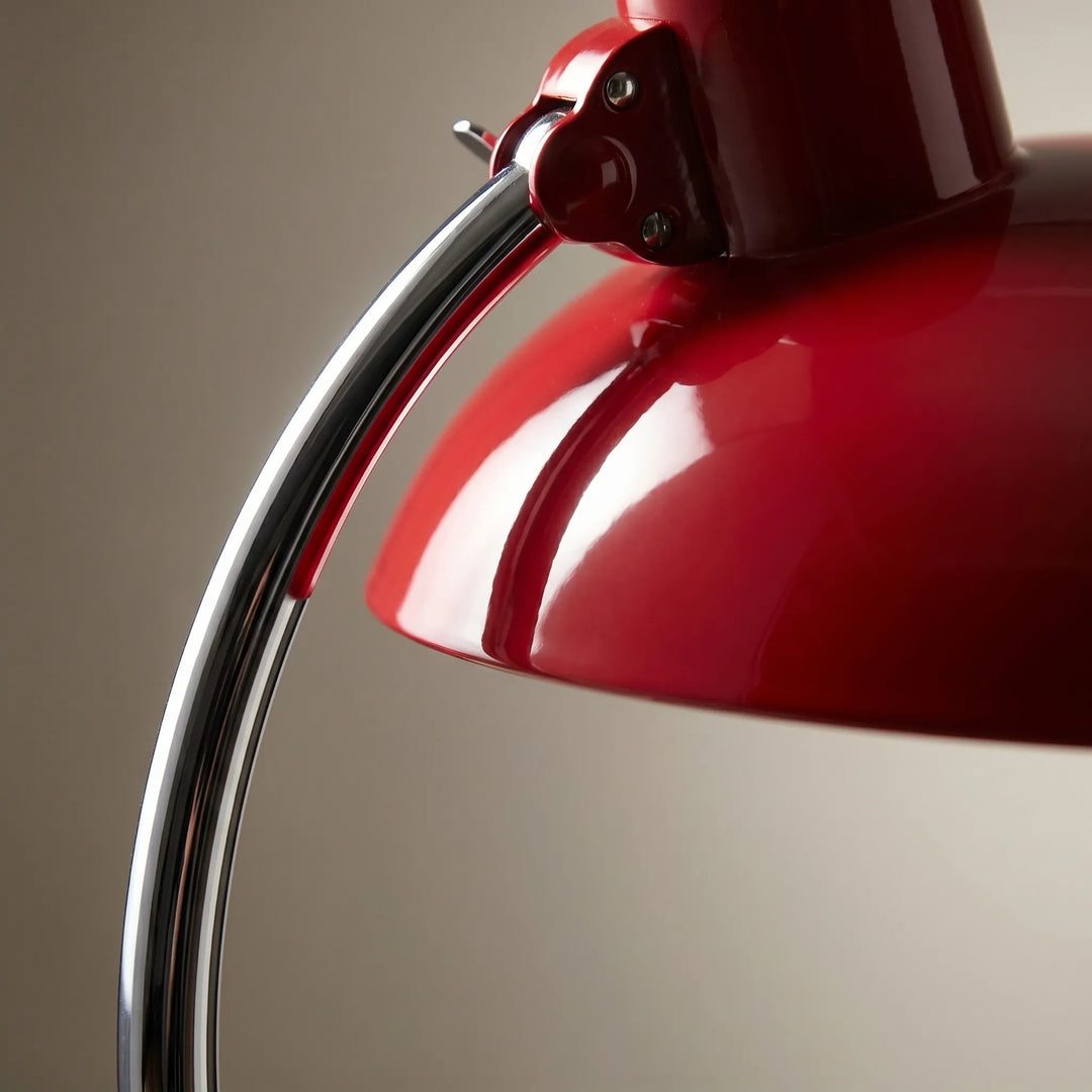 Retro mid-century metal dome desk lamp with an adjustable arm, perfect for reading or study.