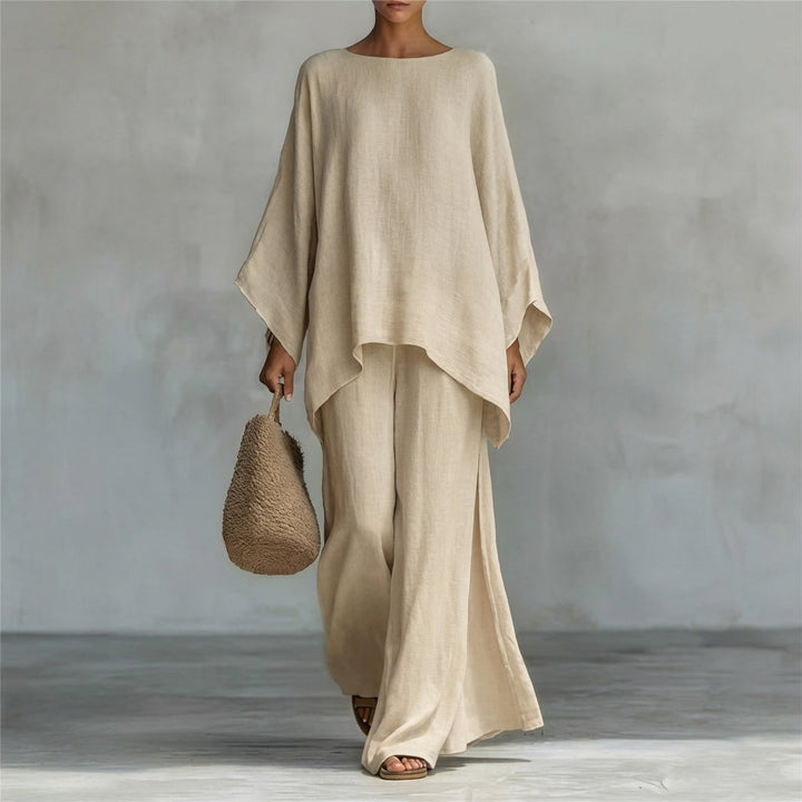 Modest women's flowing two-piece set with a relaxed tunic top & elegant maxi skirt. Ideal for comfortable fashion.