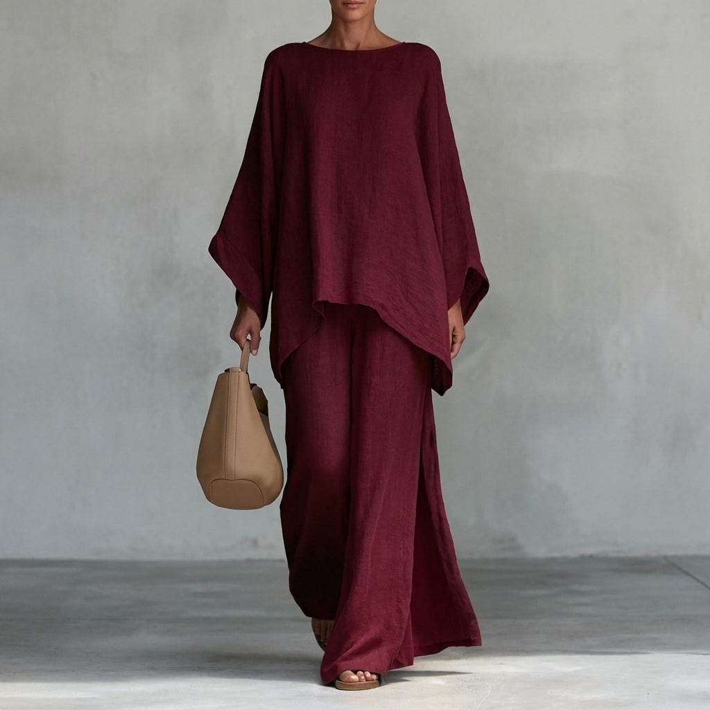 Versatile women's two-piece set: long tunic top & flowing maxi skirt. Great for travel, resort, or casual outings.