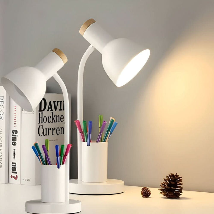 LED desk lamp with integrated pen holder for organized workspace. Modern design, eye-care lighting.