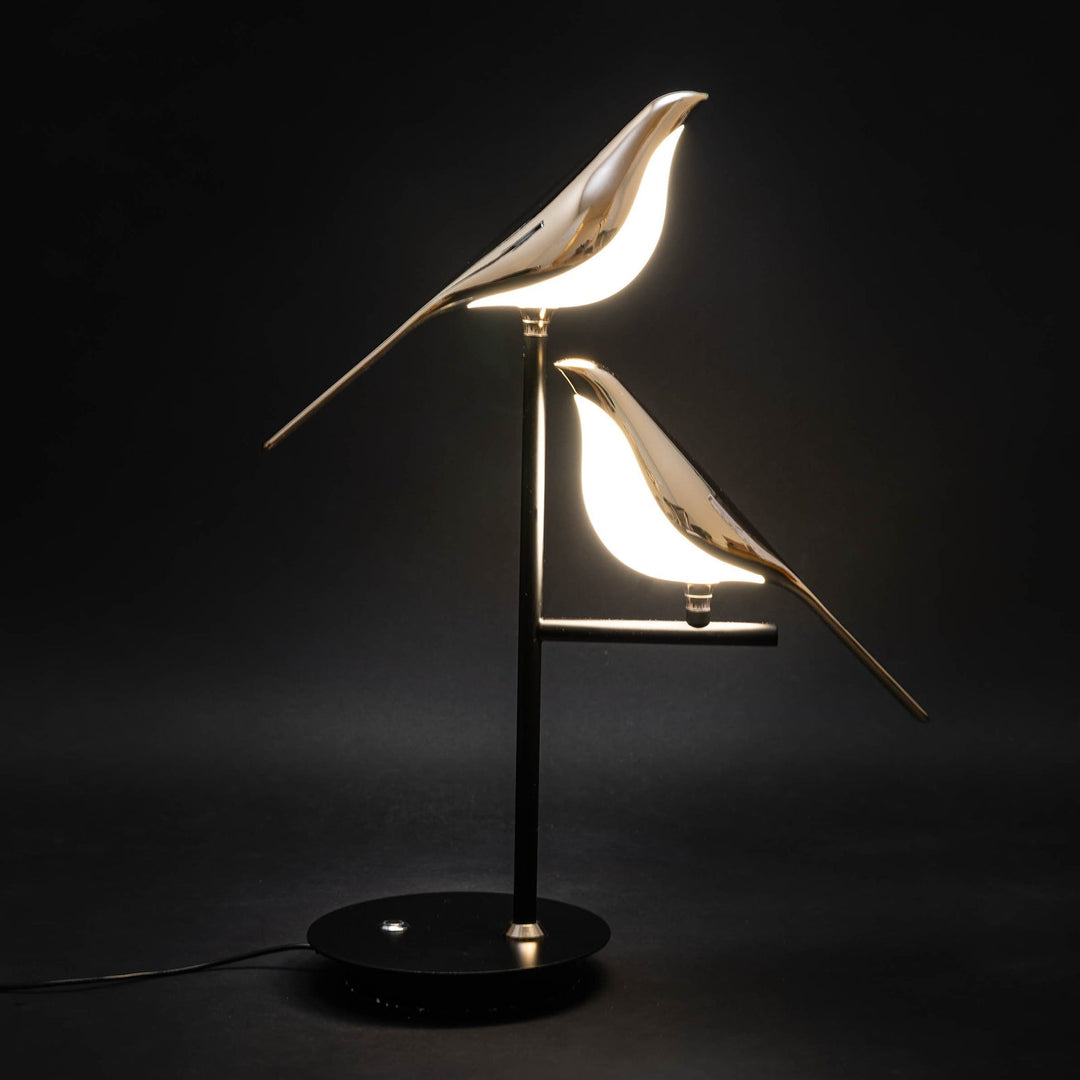 Modern LED avian wall light in a luxurious gold finish. Elegant decorative bird sconce for indoor lighting.