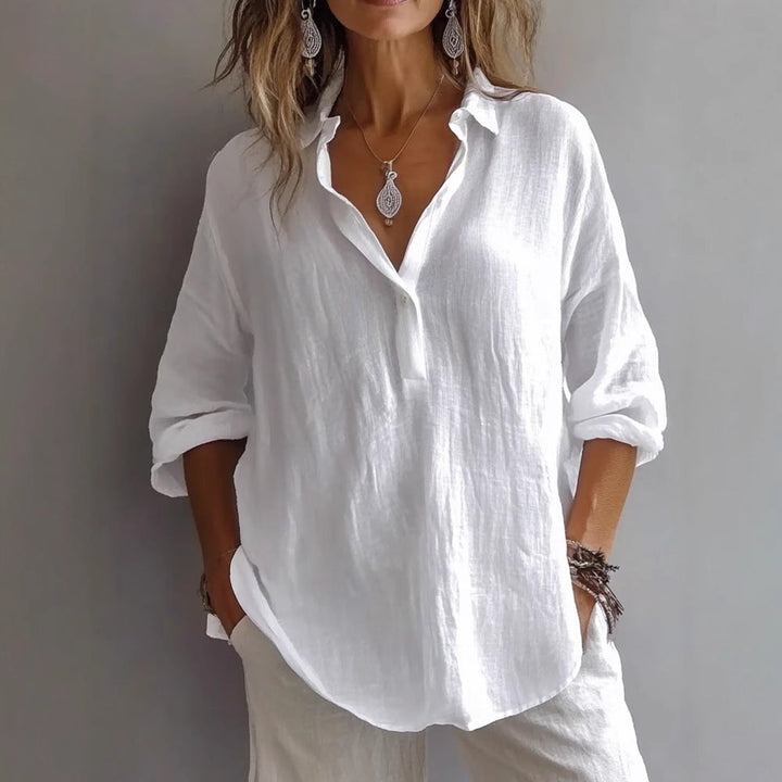 Chic women's button-down shirt with wide sleeves, great for a fashionable casual look.