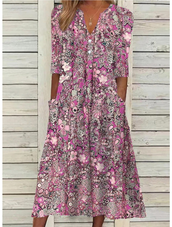 Relaxed fit women's floral print midi dress with bohemian style, V-neck, half sleeves, and flowy silhouette.