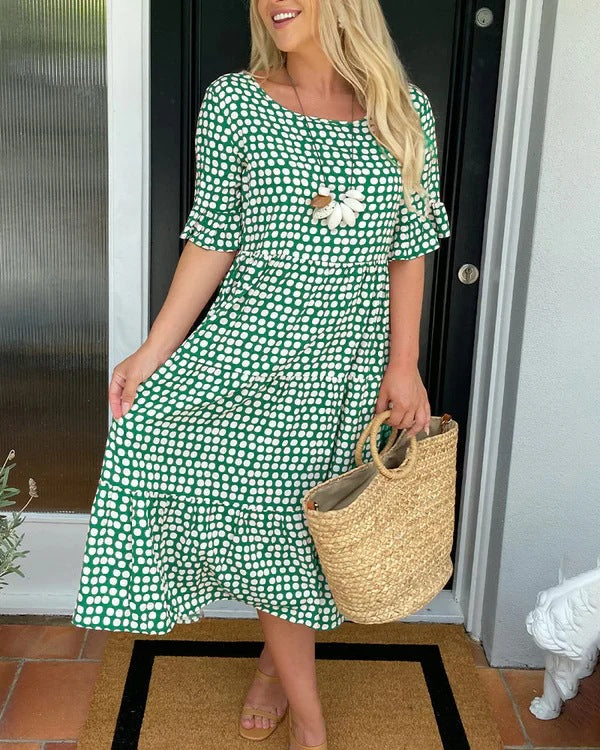 Effortless women's dotted midi dress, combining relaxed comfort with stylish versatility. Great for casual summer days.