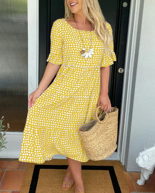 Versatile women's dotted midi dress, ideal for vacation wear or an elegant casual brunch outfit. Comfortable & flowy.