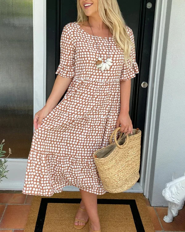 Relaxed fit women's dotted midi dress, a comfortable and versatile summer staple for any casual or elegant occasion.