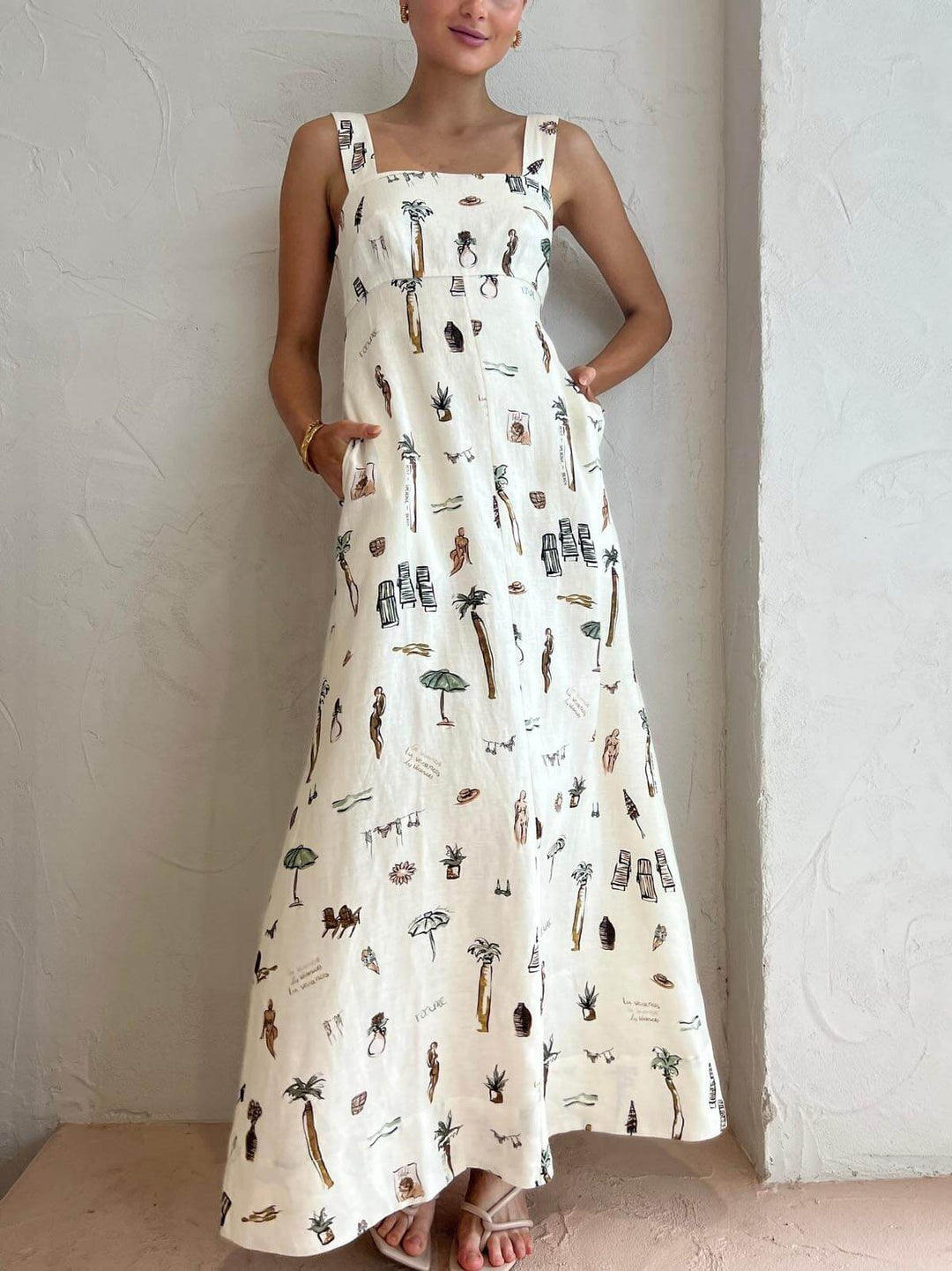Elegant women's white square neck maxi dress. Sleeveless, flowing design perfect for summer events & resort wear.