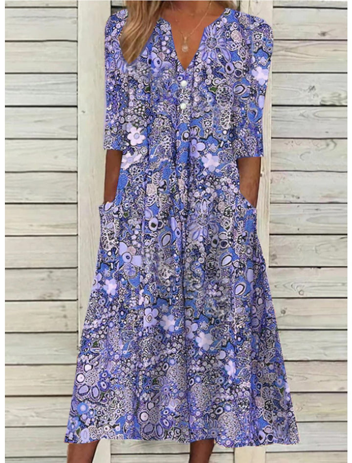 Flowy bohemian floral midi dress for women, comfortable and relaxed fit, ideal for summer vacations & day wear.