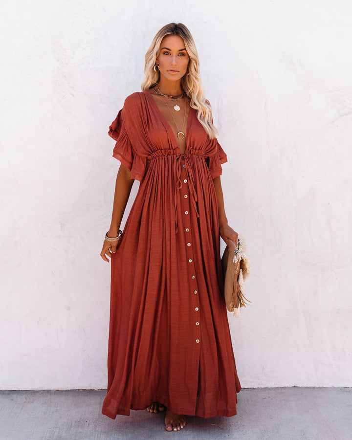 Summer vacation women's long flowy boho maxi dress with a relaxed fit, perfect for beach or resort wear.