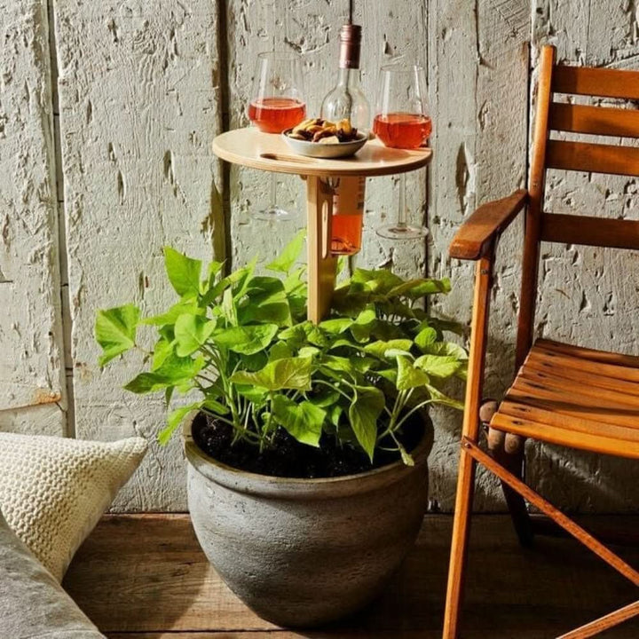 Compact, foldable outdoor wine picnic table with bottle and glass holders. Ideal for travel, beach days, and garden snacks.