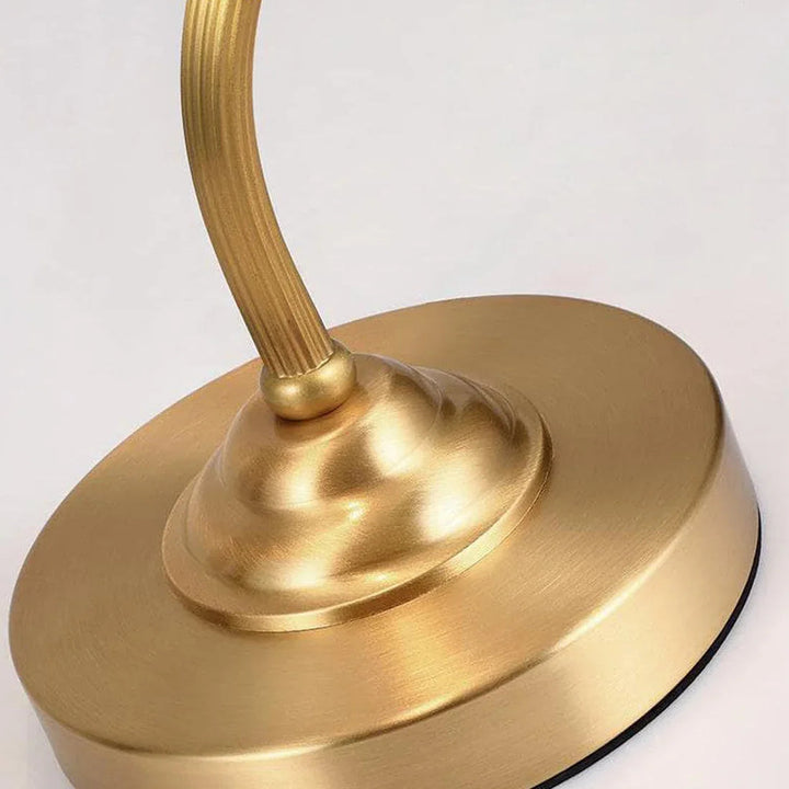 Modern elegant floral glass lamp, dimmable and gold-finished, a decorative centerpiece.