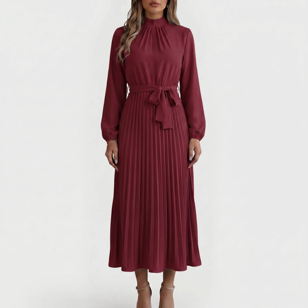 Sophisticated women's long-sleeve pleated midi dress with tie waist. Elegant office or formal wear.