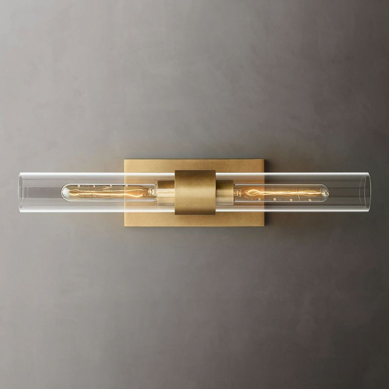 Decorative 23-inch modern brass & clear glass wall sconce, ideal interior lighting for home.