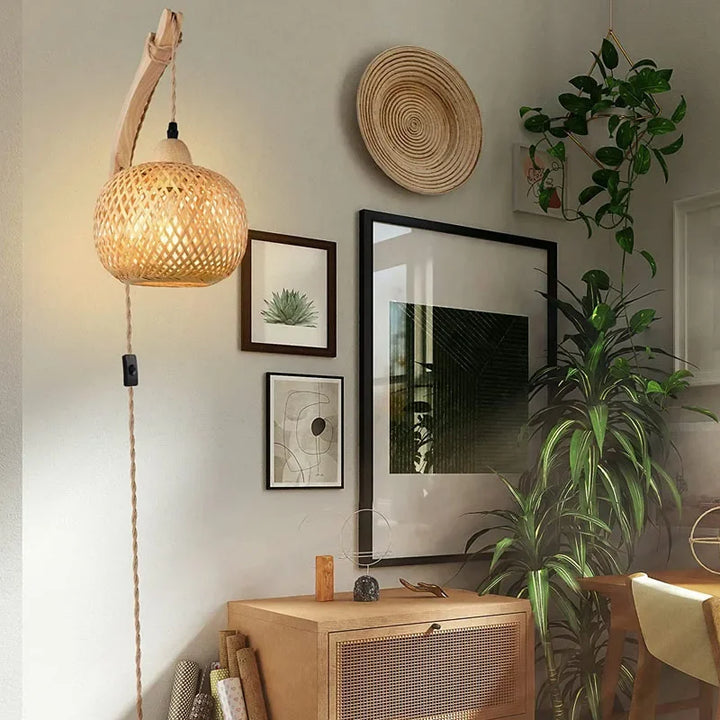 Bohemian rattan wall lantern; elegant, handwoven light fixture adds natural charm to any room.