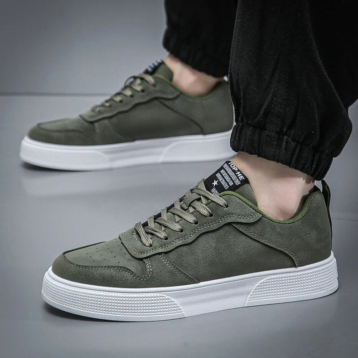 Green men's modern court sneakers, designed for comfort & versatile urban casual style. Lightweight everyday footwear.