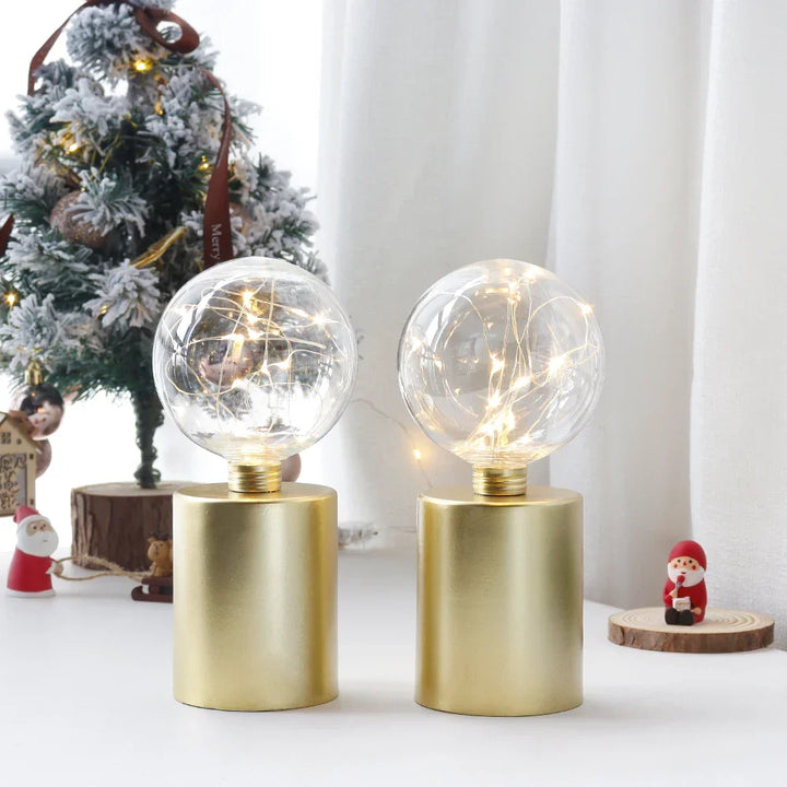 Set of 2 decorative gold cordless LED table lamps. Battery powered accent lighting for modern home decor.