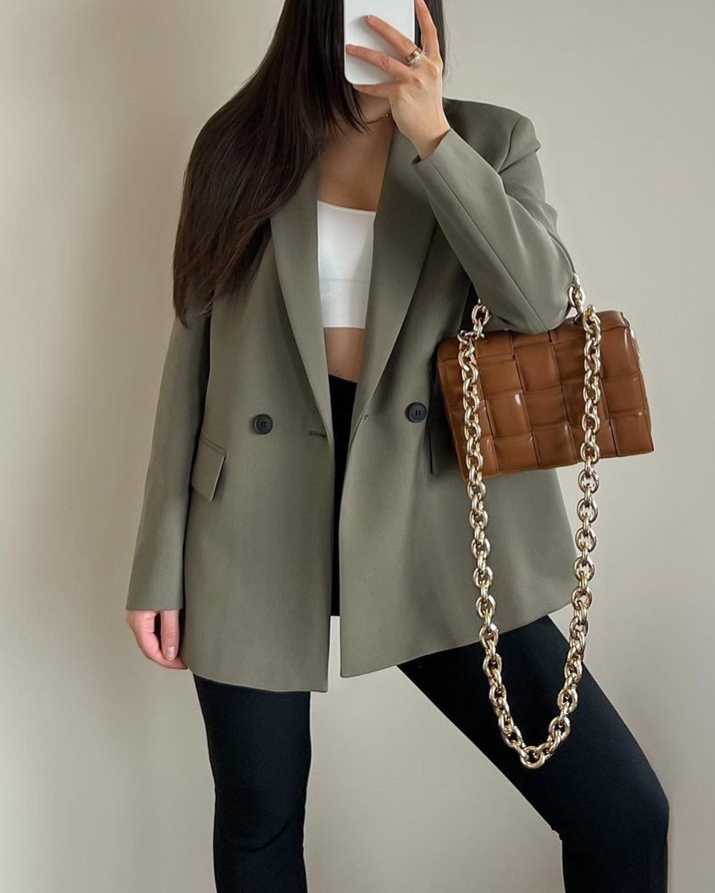 Chic women's double-breasted blazer, timeless professional style for office wear.