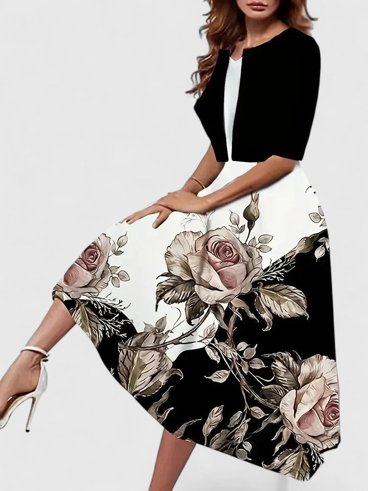 Women's flattering A-line midi dress, elegant floral print & modern colorblock style, perfect for spring occasions.