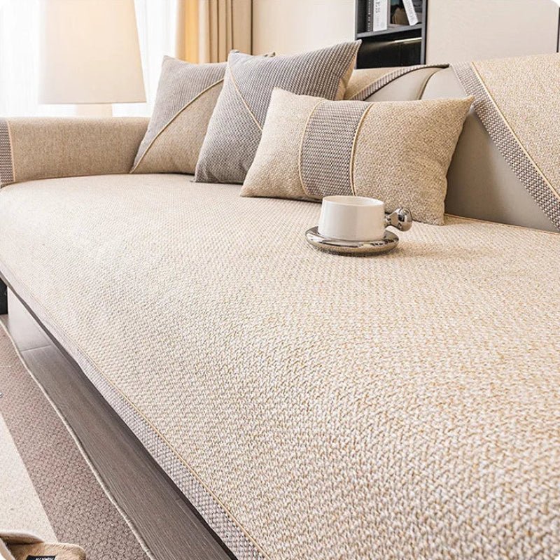 Comfortable, quilted cotton-linen sofa cover in a neutral style. Non-slip design adds elegance & protection to any couch.