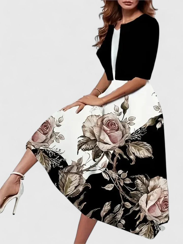 Sophisticated women's A-line midi dress, floral print & colorblock. Elegant occasion wear for spring and summer.