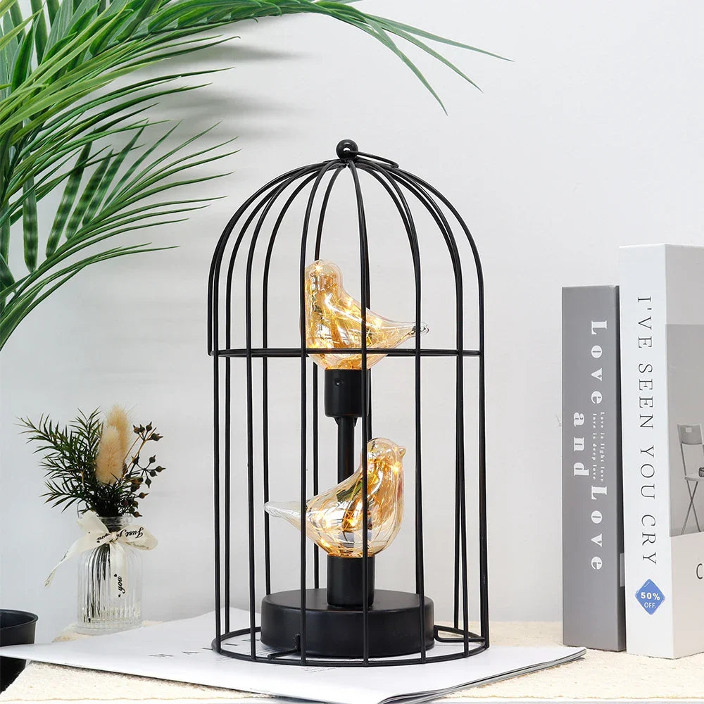 Portable battery-operated LED birdcage table lamp, a versatile fairy light decor piece.