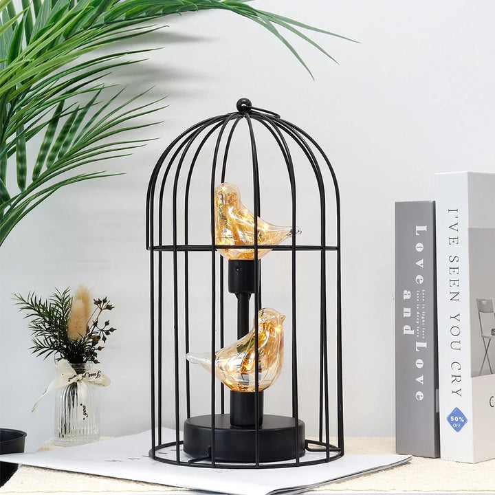 Portable battery-operated LED birdcage table lamp, a versatile fairy light decor piece.