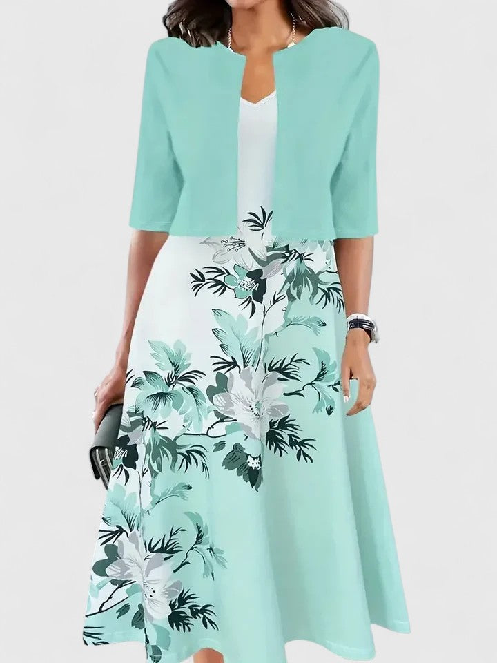 Elegant women's floral print A-line midi dress with a stylish notch neck & three-quarter sleeves, colorblock design.