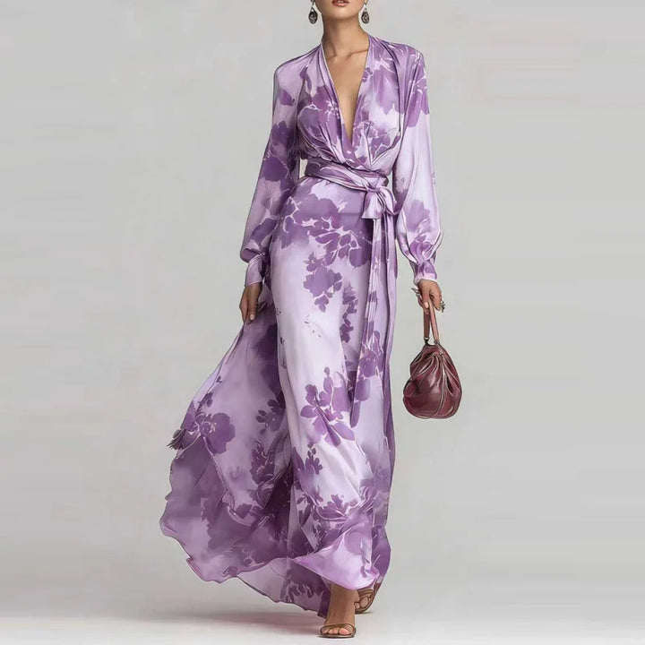 Purple flowy bohemian maxi dress for women. Stylish V-neck, elegant lantern sleeves, perfect for summer fashion.