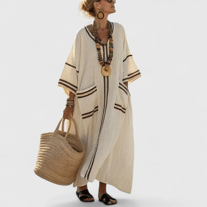 Chic women's bohemian maxi dress for summer. Flowy, comfortable long dress with pockets, great for beach & travel.
