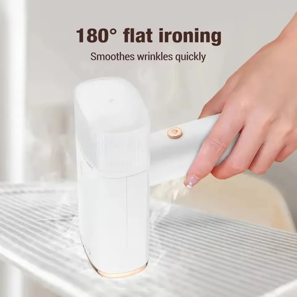 Person using a portable 1000W fabric steamer to quickly remove wrinkles from a dress. Travel-friendly clothes care.
