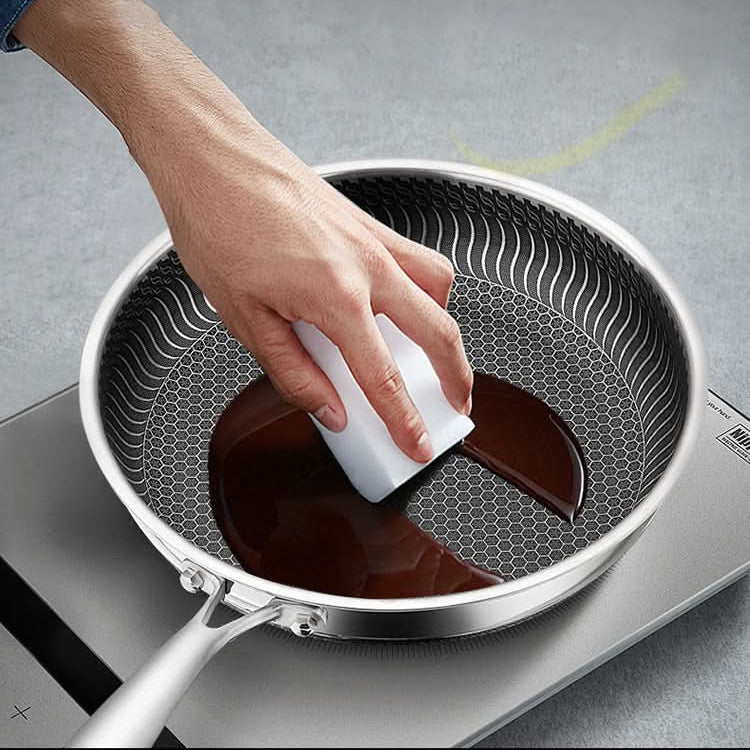 Durable stainless steel kitchen pan, ensures even heat distribution for consistent cooking results.