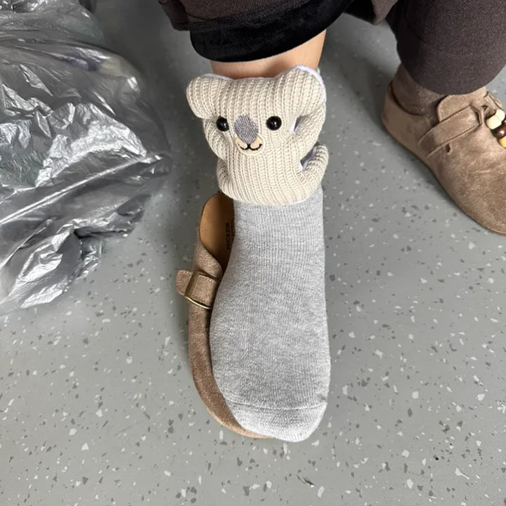 Comfortable fluffy house socks with a charming 3D animal design and secure non-slip bottom for home.