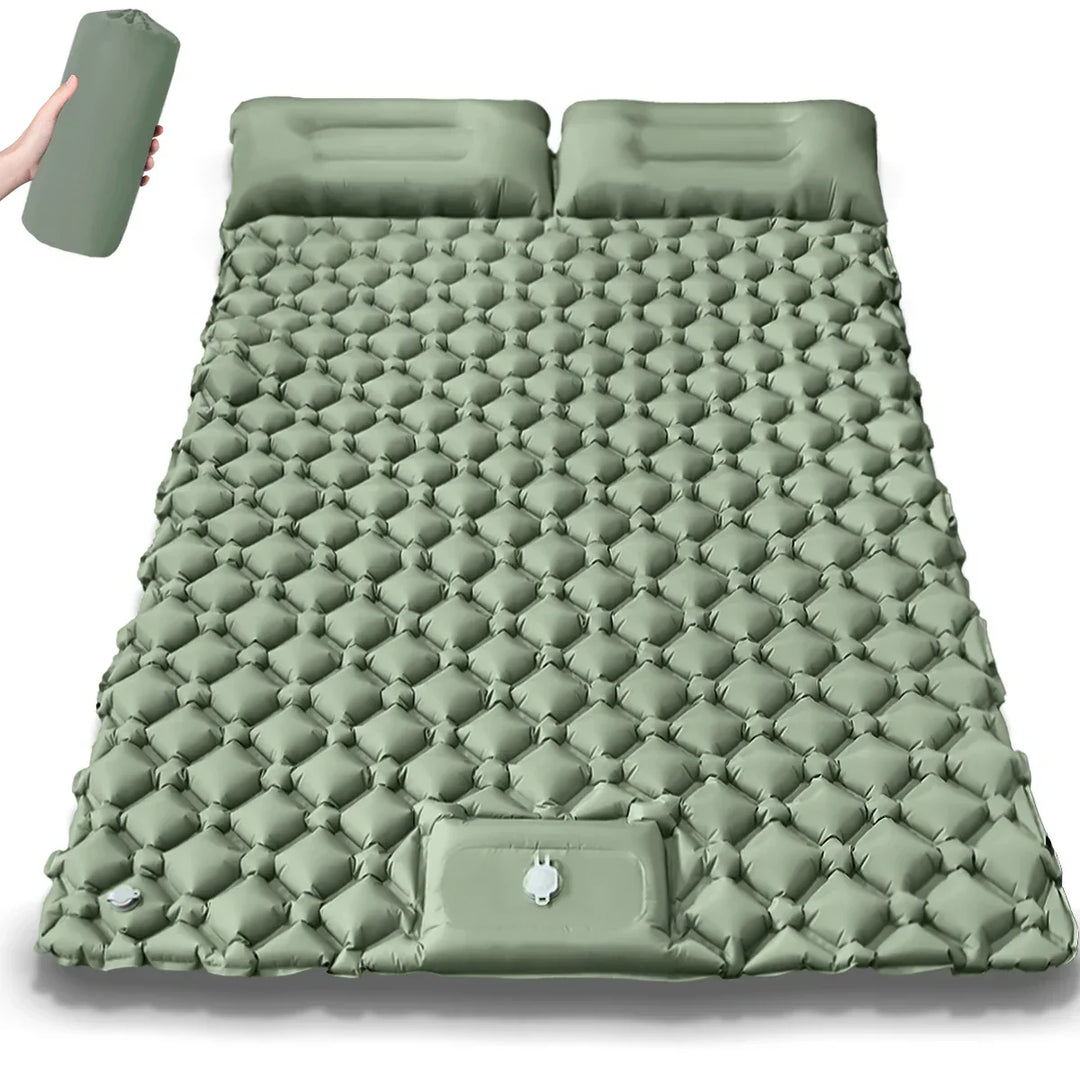 Person enjoying coffee on a dual camping air bed. Comfortable outdoor gear & adventure ready travel mattress.