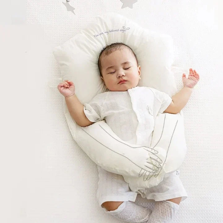 Organic cotton infant head support pillow for gentle sleep, U-shape for newborn comfort.