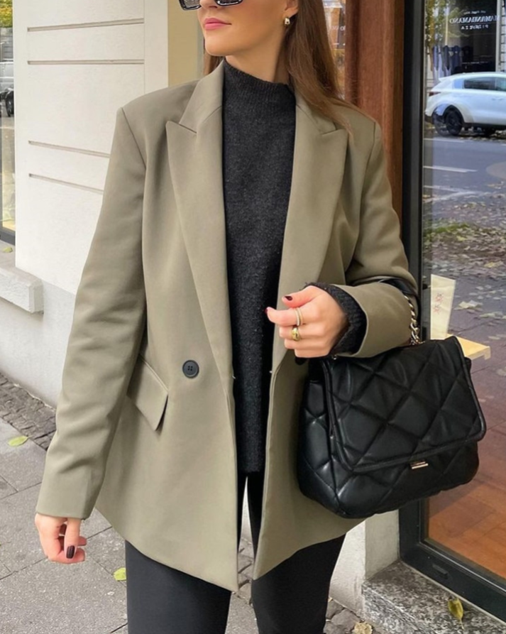 Elegant women's double-breasted blazer, perfect for business casual outfits.