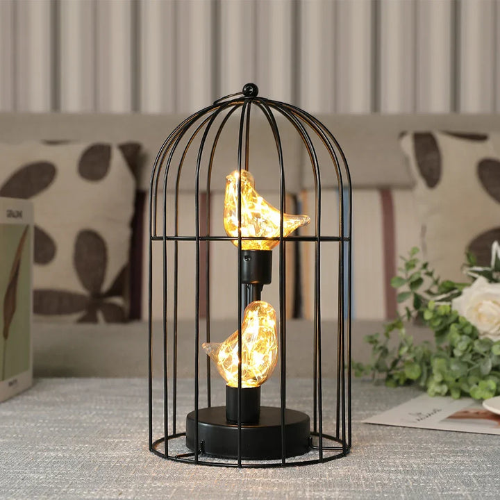 Decorative cordless birdcage lamp with LED fairy lights, ideal for vintage or modern home decor.