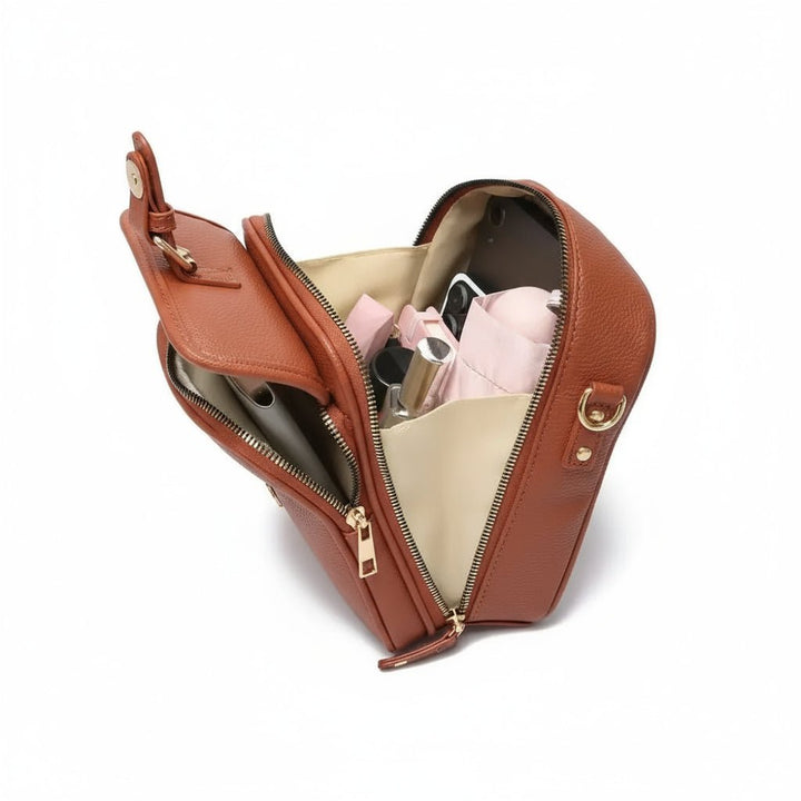 Red compact anti-theft crossbody bag. Durable & organized travel bag with secure zippers for peace of mind.
