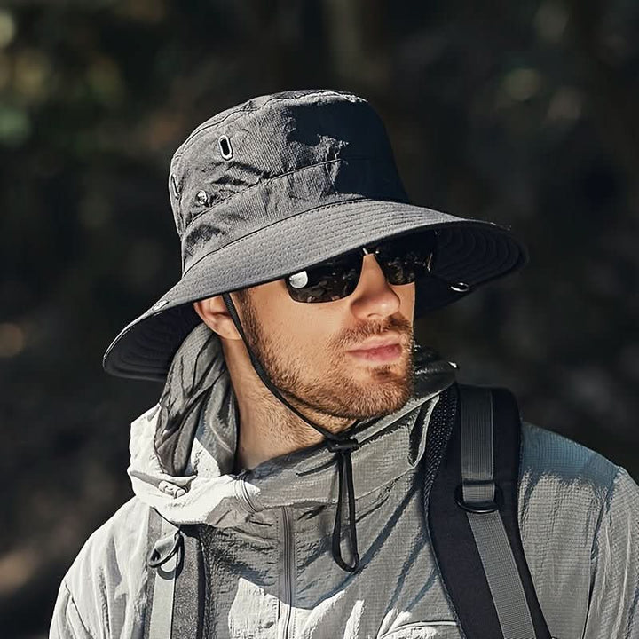 Unisex breathable sun hat with wide brim for ultimate UV protection, perfect for outdoor activities like hiking & fishing.