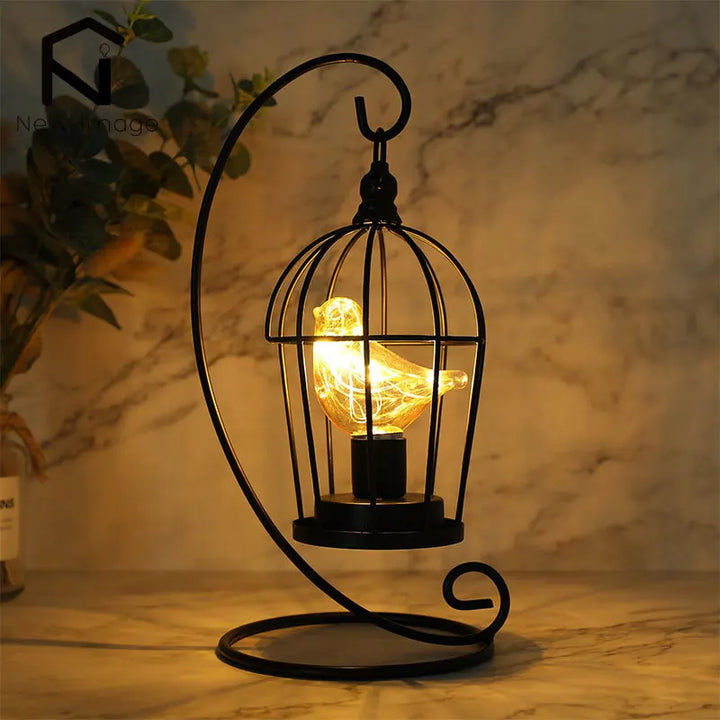 Cordless birdcage LED table lamp with enchanting fairy lights for cozy home decor.