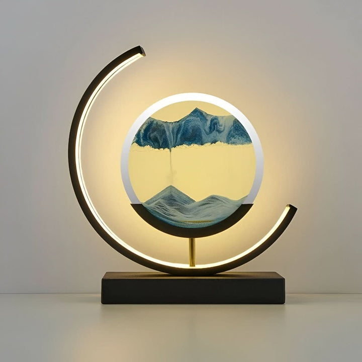 Decorative dynamic sand art LED lamp for calming ambiance. Modern table lamp with ambient lighting & relaxation.