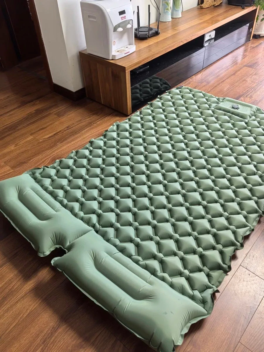 Integrated pump detail on a dual camping air bed. Quick inflation for comfortable, portable outdoor sleeping.