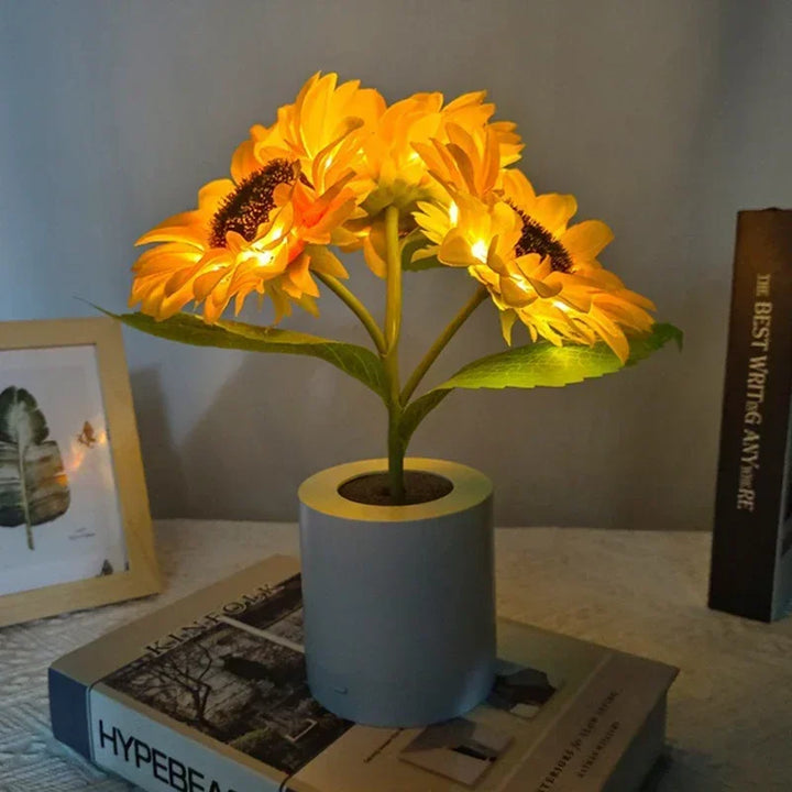 Portable rechargeable LED sunflower night light. Brightens any room as a bedside lamp or decorative accent.