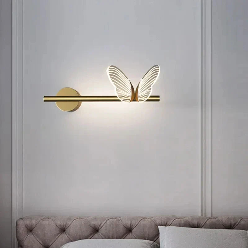 Close-up of a glowing butterfly LED wall light, showcasing intricate design & soft warm white illumination.