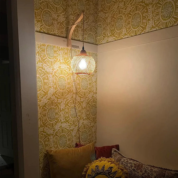Handcrafted rattan sconce, a natural design wall light perfect for rustic or boho interiors.