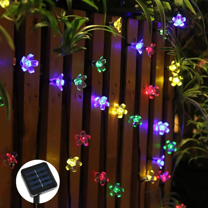 Decorative 16.4 ft solar blossom fairy lights for garden, patio & outdoor party decoration.