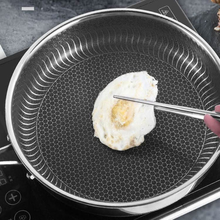Robust stainless steel cookware with even heat technology, a durable frying pan for daily use.
