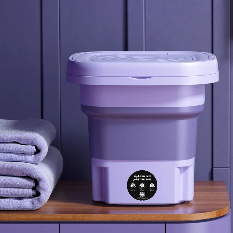 Small footprint green mini washer with spin dryer, ideal for single users, small loads, and limited space.