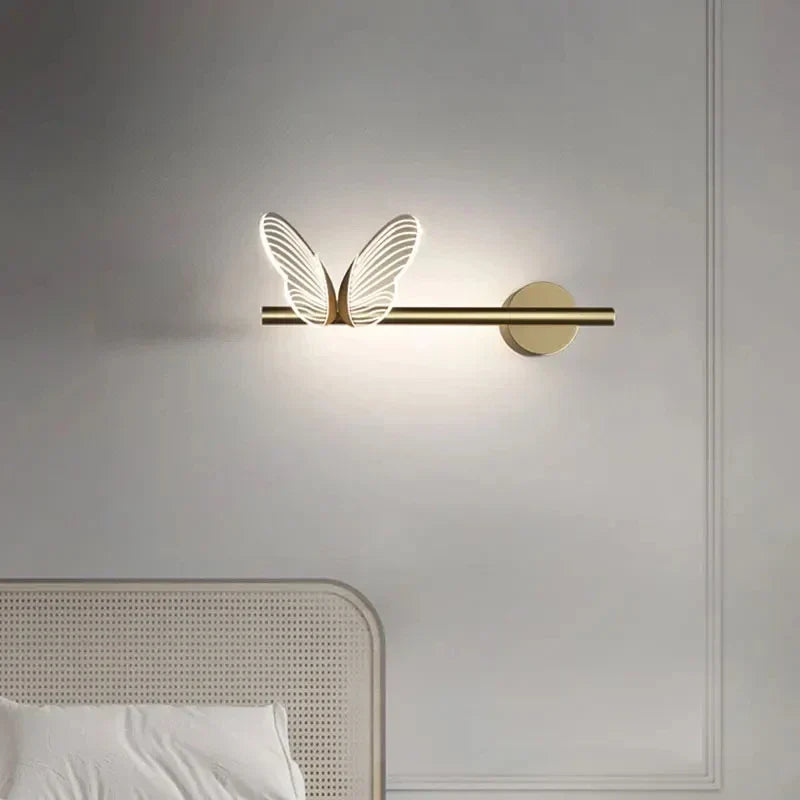 White butterfly LED wall lamp casting a gentle night light, ideal for cozy bedroom lighting & home decor.